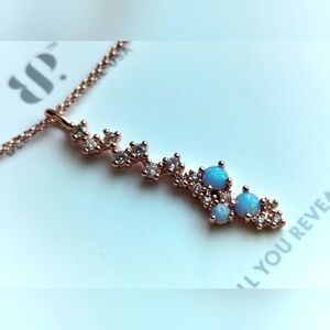 She runs the show bomb party OG Necklace light blue fire opal rose gold plating